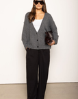 Soft fuzzy knit cardigan
Long sleeve
V-neckline
Button down closure
Unlined
dark grey oversized cardigan
fall outfit
thanksgiving outfit
v neck sweater
v neck cardigan