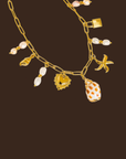 18K Gold Non-Tarnish Shell and Pearl Charm Necklace
18K Gold Plating
Stainless Steel
sea shell charm necklace