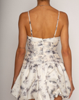 Floral printed woven dress. Adjustable straps. Ruched bodice. Bubble hem with elastic opening. Back hook and eye and zipper closures. Fully lined. bridal dress. bridal. bride. white mini bubble dress.