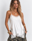 Cream Satin tank top
Lace detailing
Adjustable spaghetti straps
Side slits
Unlined/Partially sheer