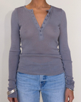 grey Ribbed knit top
Henley neckline with button closure
Long sleeves
Unlined