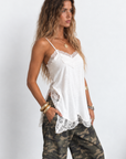 Cream Satin tank top
Lace detailing
Adjustable spaghetti straps
Side slits
Unlined/Partially sheer