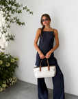TOP
navy blue Satin tunic top
Adjustable spaghetti strap
Droop back
Unlined
BOTTOM
navy blue Satin pant
Elastic waistband
Unlined