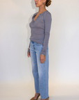 Mid rise bowed straight leg jean
Button and zipper fly
Five pocket construction
No stretch
Light wash with lived in fading around the knees and thighs