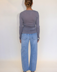 Mid rise bowed straight leg jean
Button and zipper fly
Five pocket construction
No stretch
Light wash with lived in fading around the knees and thighs