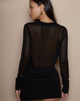 Black sheer knit top. Collar neckline. Long sleeves. Front button down closure. Unlined/sheer. going out top. holiday top. fall top. winter top.