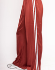 Red track pants with baby blue stripes on side
Satin track pant
Elastic waistband
Hidden adjustable drawstring
Contrast sport stripe on side
2 side pockets
Unlined
burgundy and baby blue track satin pant