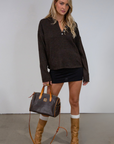 Fuzzy heather crochet knit sweater. Henley quarter neckline with button down closures. Long sleeves. Unlined. brown pullover. brown sweater. fall sweater. fall outfit