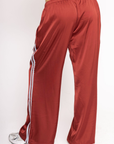 Red track pants with baby blue stripes on side
Satin track pant
Elastic waistband
Hidden adjustable drawstring
Contrast sport stripe on side
2 side pockets
Unlined
burgundy and baby blue track satin pant