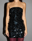 black Sequin strapless mini dress. Elastic neckline. Inner rubber grip lining. Side hook and eye and zipper closures. Fully lined. holiday look. holiday outfit. new years outfit. new years mini dress. christmas dinner dress
