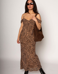 Animal printed chiffon maxi dress. Adjustable straps. Off the shoulder sleeves. Back tie closure. Fully lined. leopard print maxi dress. fall dress. sporing dress. summer dress