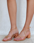 Meyli by Billini is a tan strappy low block heel.