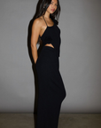 TOP: Black Ribbed knit tank top. Adjustable halter tie neckline. Rosette details. Side slit. Unlined.
BOTTOM: Black Ribbed knit maxi skirt. Elastic waist. Back slit. Unlined.
Black set. holiday outfit. christmas outfit. nice christmas outfit