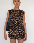Animal printed elastic smocked top. Sleeveless. Open back with tie closure. Elastic back. Unlined. leopard print tank top. cheetah print tank top. going out top. going out outfit. summer outfit. spring outfit