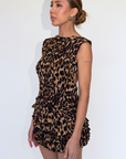 Animal printed elastic smocked top. Sleeveless. Open back with tie closure. Elastic back. Unlined. leopard print tank top. cheetah print tank top. going out top. going out outfit. summer outfit. spring outfit