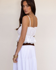 white Button down tank top
Lace trim
Adjustable front tie
Sleeveless
Straight neckline
Adjustable straps
summer tank top
country side tank top