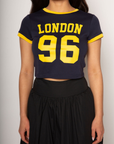 Graphic printed knit crop ringer tee. Crewneck. Short sleeves. Unlined. london graphic tee. baby crop tee