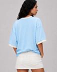 Game on. Keep your eye on the ball in this OS Ringer Short Sleeve Tee designed in colors inspired by the Team Argentina jersey.
Featuring an athletic influence with rib contrast along the neckline and arms.
Oversized fit and length, accented with dropped shoulders
Available in just one size
Length: 27.5"
Cotton
blue argentina world cup jersey tee