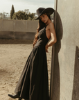Woven maxi dress. Adjustable crisscross back straps. Back hook and eye and zipper closures. Fully lined. black maxi dress. country outfit. country dress. western outfit. western dress.