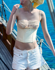 cream Sleek satin bustier with lace detailing
Fully boned bodice
Adjustable lace-up back
Skinny tie bow
Rosette adornments
Lined at cups
Adjustable shoulder straps
Polyester/Elastane
cream ligneire bustier top