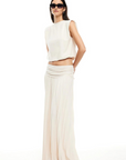 Knit maxi skirt. Elastic wide waistband. Pleated skirt. Fully lined. Slightly sheer. white mxi skirt. white lioness skirt.
