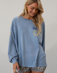 blue Graphic printed acid wash knit top. Crewneck. Long sleeves. Unlined.