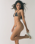 Skimpy polka dot cinch string bikini bottom
Side string tie side
Made from matte Italian supplex