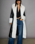 Faux leather longline coat. Faux fur trim. Collar neckline. Long sleeves. Open front. Tie waist. Fully lined. black leather coat. fur coat. coat for winter. cute leather coat. fashionable leather coat