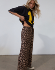 Animal printed woven pants. Elastic waistband with drawstring closure. Unlined.