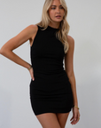 Sleeveless knit dress. Mock neck. Ruched sides. Fully lined. black mini dress. black mock neck mini dress. fall dress. fall outfit