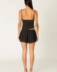 black Flowy mini skirt skort
Layered skirt effect
Mid-rise elastic waistband and an adjustable tie
Concealed shorts underneath
Viscose/Spandex