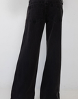 black Super low-rise waist jeans that sits right on your hips
These jeans hug your butt and thighs before flaring from hip to hem for that full-leg moment
Cut lower at the front with added coverage at the back
Cotton/Recycled Cotton