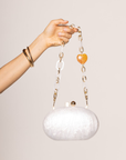 ivory Hardshell marble clutch
Magnetic closure
Acrylic chain straps with heart detail
Removable long and short chain
Synthetic
