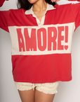 Graphic printed knit top. Collar neckline. Long sleeves. Unlined. amore graphic tee. valentines day outfit. lounge wear