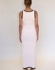 cream Crochet knit maxi dress. Sleeveless. V-neckline. Front button down closures. Faux front pockets. Unlined. cream knit maxi dress. knit button down maxi dress
