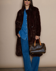 Faux fur longline coat. Collar neckline. Front button closures. Front pockets. Back slit. Fully lined. brown long fur coat. fall coat. winter coat. layering piece.