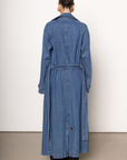 Denim long line trench coat
Adjustable and removable belt
Double breasted button down closure
Unlined
blue denim trench coat