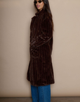 Faux fur longline coat. Collar neckline. Front button closures. Front pockets. Back slit. Fully lined. brown long fur coat. fall coat. winter coat. layering piece.