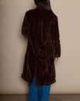 Faux fur longline coat. Collar neckline. Front button closures. Front pockets. Back slit. Fully lined. brown long fur coat. fall coat. winter coat. layering piece.
