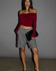 Knit crop top. Strapless elastic folded neckline. Front and back ruching. Long sleeves. Unlined. red off the shoulder long sleeve top. burgundy off the shoulder long sleeve top. holiday outfit. holiday look. christmas top. christmas outfit