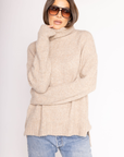Fuzzy marled knit oversized sweater
Turtleneck
Long sleeves
Step hem
Unlined
tan turtle neck sweater