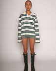 Striped knit top. Collar neckline. Front button closures. Long sleeves. Unlined. striped polo long sleeve. fall top. fall outfit