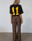 Animal printed woven pants. Elastic waistband with drawstring closure. Unlined.