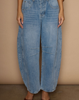 Barrel leg jeans. Button fly. Five pocket construction. Unlined. medium wash jeans.