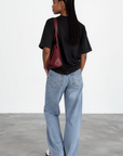 The fabric feels luxuriously soft and smooth against the skin, offering a breathable, lightweight comfort
Relaxed crew neckline
Cuffed sleeves
Length: 29.5"
50% cotton/50% modal butter jersey knit
black oversized basic tshirt top