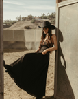Woven maxi dress. Adjustable crisscross back straps. Back hook and eye and zipper closures. Fully lined. black maxi dress. country outfit. country dress. western outfit. western dress.