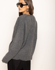 Soft fuzzy knit cardigan
Long sleeve
V-neckline
Button down closure
Unlined
dark grey oversized cardigan
fall outfit
thanksgiving outfit
v neck sweater
v neck cardigan