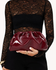 crinkly maroon burgundy clutch bag by billini