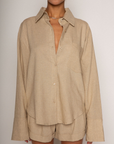 Tan Linen woven long sleeve collared top
Button down closure
Front pocket
Button closure on sleeves
Unlined
Resort lounge wear