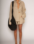 Woven high waisted linen shorts
Zipper button closure
Belt loops
Faux back pocket
Side pockets
Bottom fold up detail
Unlined
Summer tan linen shorts
Resort wear